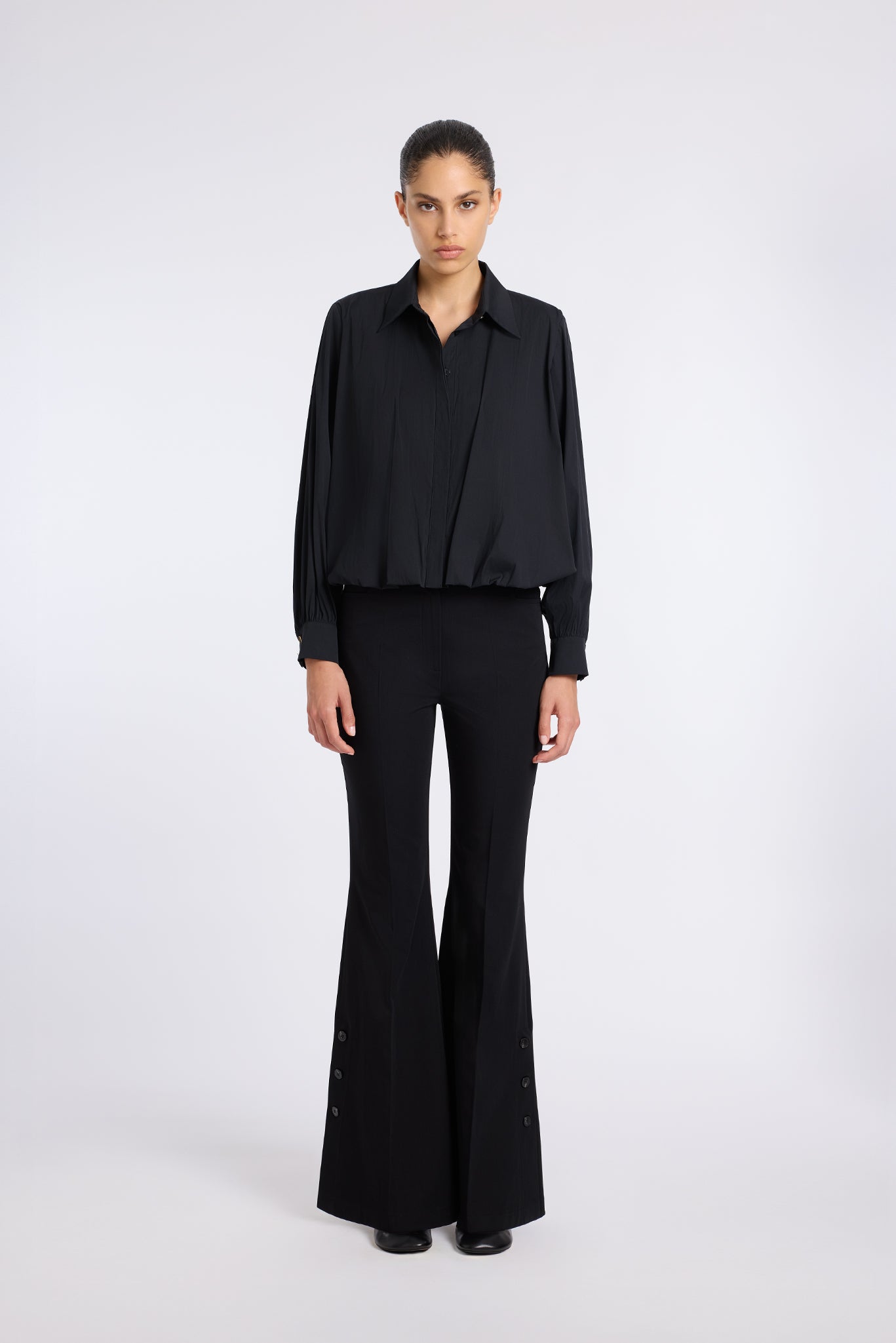 BLACK FLARED PANTS WITH BUTTON DETAIL