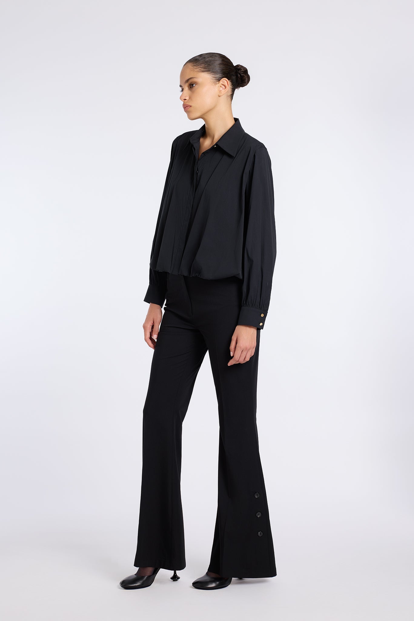 BLACK FLARED PANTS WITH BUTTON DETAIL